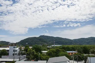a view of a city with a mountain in the background at Fully Furnished Apartment - NV-622 in Chalong
