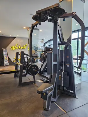 a gym with a treadmill and a elliptical machine at 1BDR King size bed 3 Restaurants 500m to beach in Kamala Beach