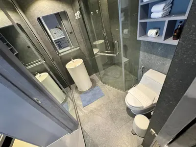 a bathroom with two toilets and a shower at 1BDR Roof pool 500m to beach Great gym Parking in Kamala Beach