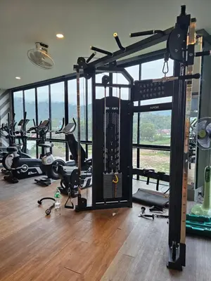 a gym with a bunch of treadmills and machines at 1BDR Roof pool 500m to beach Great gym Parking in Kamala Beach
