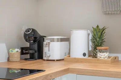 a kitchen counter with a coffee maker and a mixer at Title Halo Nature Touch 40m2 King Bed Naiyang in Nai Yang Beach