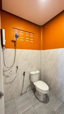 a bathroom with a toilet and a shower at Cheriya bungalow Kohyaonoi in Ban Laem Sai