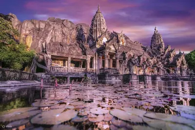 a temple with a pool of water in front of it at Tropical & Relaxing Stay at Tropics Kamala Suite CTG L304, Top Amenities, close to FantaSea and Café Del Mar Beach Club in Kamala Beach