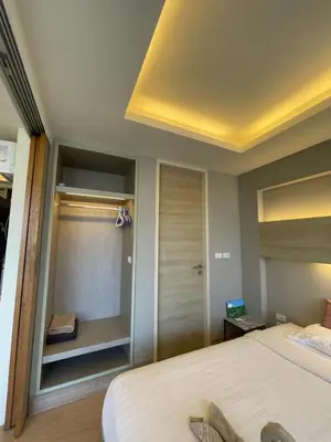 a bedroom with a large bed and a closet at Cozy corner in Ao Nang Beach