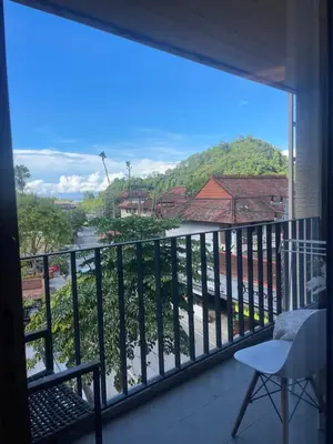 a balcony with a view of a river at Cozy corner in Ao Nang Beach