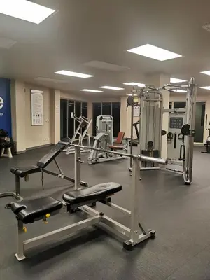 a gym with several tread machines in a room at Veloche Karon 12 in Karon Beach