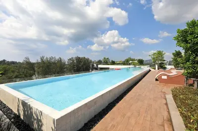 a large swimming pool on top of a building at Sky Park condo 1 bedroom in Laguna Phuket