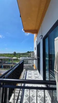 a balcony with a view of the ocean at Smile Boutique at Saiyuan in Rawai Beach