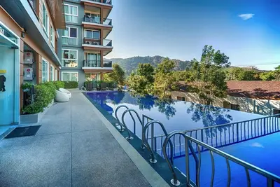 a swimming pool in the middle of a building at Cozy apartment at peaceful Rawai Condo in Rawai Beach