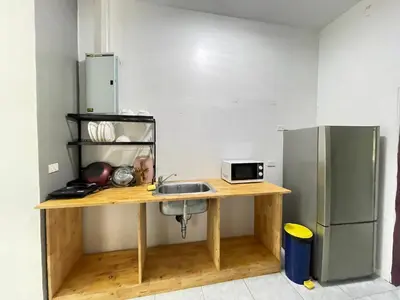 a kitchen with a sink and a refrigerator at Phuket Patong Plan B house in Patong Beach