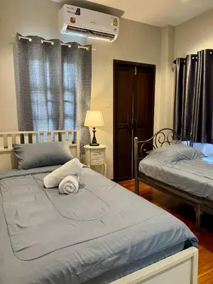 a bedroom with two beds and a air conditioner at 103-25 Kathu Waterfall in Phuket Town