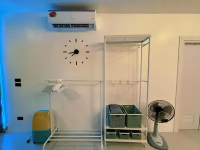 a clock on a wall next to a room at Ground Floor Zen Space Kamala in Kamala Beach