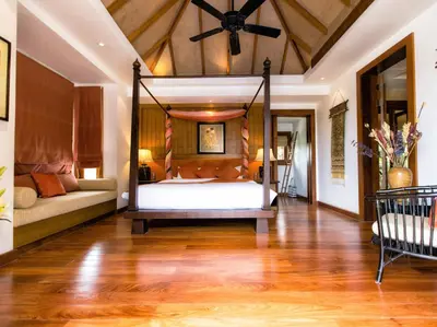 a bedroom with a swing bed in a room at Baan Surin Sawan in Surin Beach