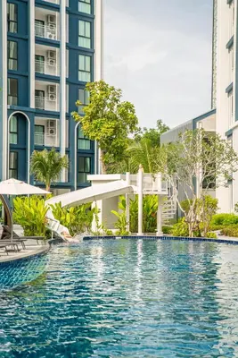 a swimming pool in the middle of a building at Title Halo Life in Yellow 40m2 King Bed Pool in Nai Yang Beach