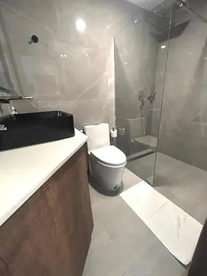 a bathroom with a toilet and a shower at Zcape 2 Boat Avenue, Laguna Brand New Renovated One bedroom Apartment with the Mountain View in Bang Tao Beach