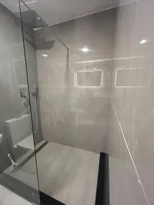 a shower with a glass door in a bathroom at Zcape 2 Boat Avenue, Laguna Brand New Renovated One bedroom Apartment with the Mountain View in Bang Tao Beach