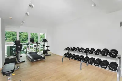 a gym with a lot of treadmills and exercise equipment at Beach Life & Surf Thrills, Stay at Kata Suite 8-132 in Kata Oasis Residence in Kata Beach