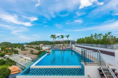 a swimming pool on the roof of a building at Beach Life & Surf Thrills, Stay at Kata Suite 8-132 in Kata Oasis Residence in Kata Beach
