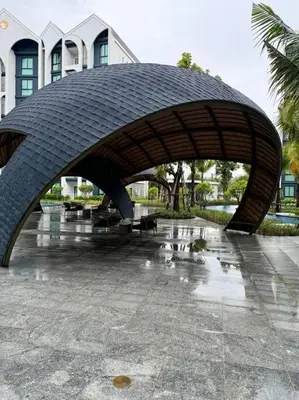 a stone archway in front of a building at Super Naiyang Title 1Bdr 600m to beach in Nai Yang Beach