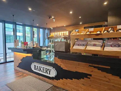 a bakery with a display case in a store at Kamala CityGate Apartments in Kamala Beach