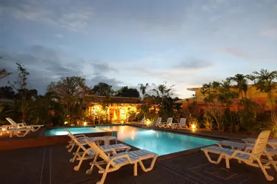 a swimming pool with lounge chairs and a resort at Bida Daree Resort in Ao Nang Beach