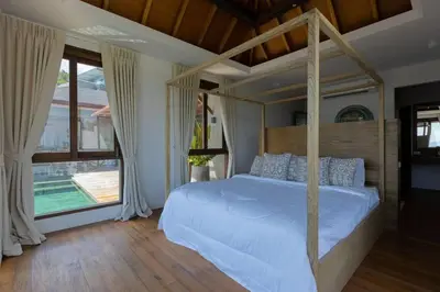 a bedroom with a canopy bed and a large window at \u67e5\u9f993\u5367\u5ba4\u534a\u5c71\u6d77\u666f\u522b\u5885 in Ban Na Kok