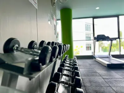 a gym with a row of seats in a room at The Regent Bangtao by RESAVA in Bang Tao Beach