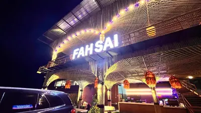 a building with a sign on it at night at Fahsai Hostel in Ao Nang Beach