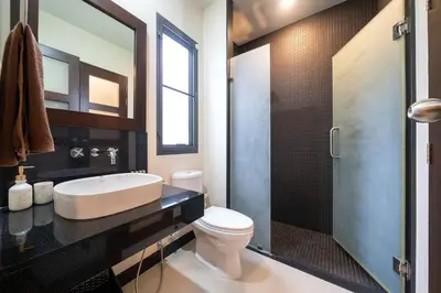 a bathroom with a sink and a toilet and a shower at Onyx 2 br private pool Rawai in Ban Saiyuan (1)