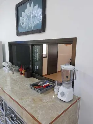 a kitchen counter with a blender on top of it at Smile house in Karon Beach