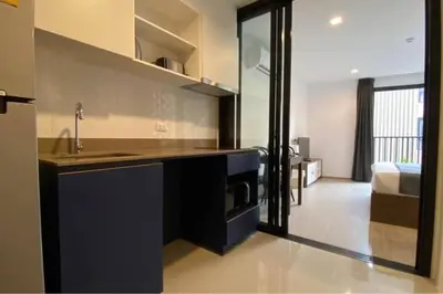 a kitchen with a sink and a counter top at Mode apartment central Phuket in Phuket Town
