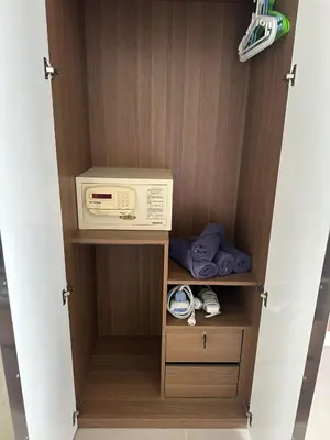 a cupboard with a washing machine in it at Patong tower sea view in Patong Beach
