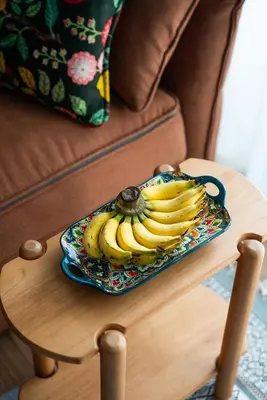 a plate of bananas sitting on a table at Title Halo Time for Jungle 40m2 King Bed Pool in Nai Yang Beach