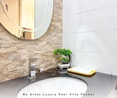 a bathroom with a sink and a mirror at Luxury Pool Villa 5 mins to Phuket Old Town in Ban Lo Long