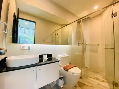 a bathroom with a toilet and a sink and a shower at A16 Oceana Kamala in Kamala Beach