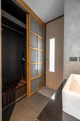 a bathroom with a tub and a sink and a mirror at Studio Sora Rooftop Pool ReLife Nai Harn Beach in Rawai Beach
