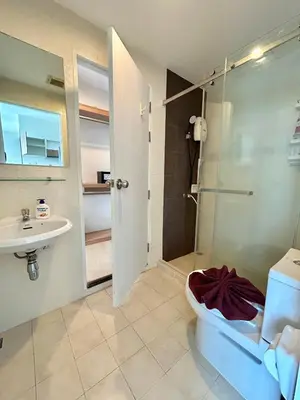 a bathroom with a shower and a toilet and a sink at 2 bedrooms Condos in Bangtao in Bang Tao Beach
