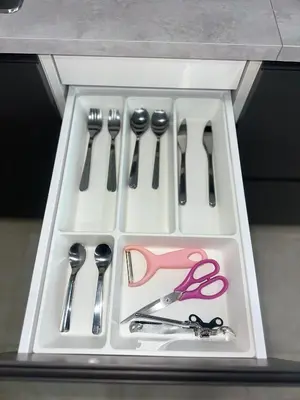 a tray with utensils and scissors on a counter at Apartment Karon SeaView 72 sq in Karon Beach