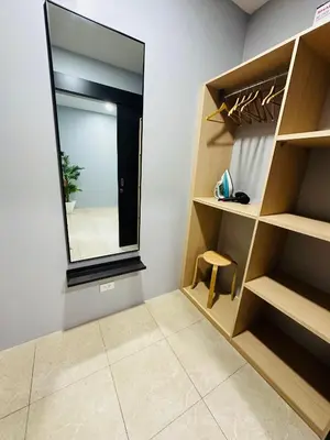 a walk in closet with a large mirror at Apartment Karon SeaView 72 sq in Karon Beach