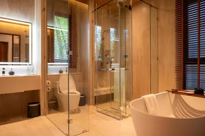 a bathroom with a tub and a toilet and a shower at Sinae Residence in Ban Lo Ti Pa (1)
