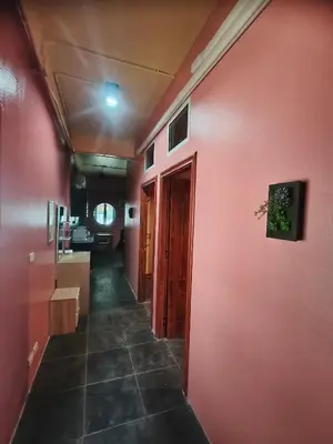 a hallway of a room with a red wall at Bonanza Patong Beach2 for 2 BR 100m to Beach Grace Room in Patong Beach