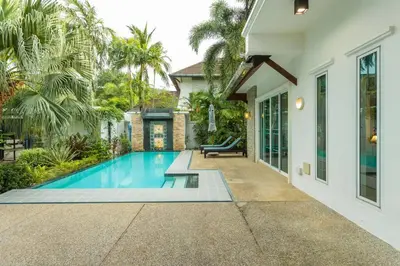 a swimming pool in the backyard of a house at 15 Minuets Walk 2 BangTao Beach Fully Loaded v134 in Bang Tao Beach