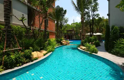 a swimming pool in the middle of a resort at Apart Pool Access Naiyang Beach in Nai Yang Beach
