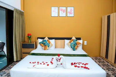 a bedroom with a bed with red hearts on it at Burning Flame Patong in Patong Beach