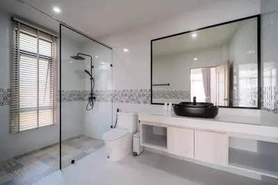 a bathroom with a sink and a toilet and a mirror at Pool Villa Alawan Krabi Klong Muang R2 in Klong Muang Beach