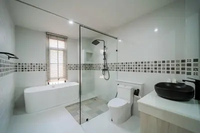 a bathroom with a sink toilet and a glass shower at Pool Villa Alawan Krabi Klong Muang R2 in Klong Muang Beach