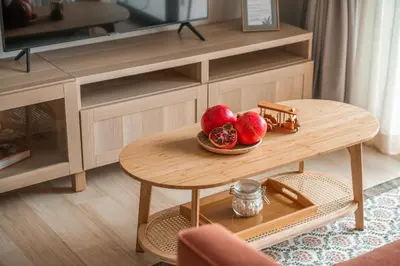 a bowl of fruit on a table in a living room at Title Halo Orange Sunset 46m2 Naiyang Pool&Gym in Nai Yang Beach