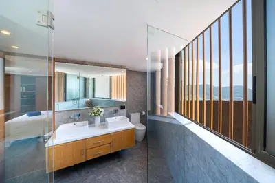 a bathroom with two sinks and a mirror at Luxury Ocean View 2BR Apartment 82 in Sapphire Bay Residence, near Patong and Paradise Beach in Patong Beach