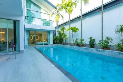a swimming pool in front of a house at Nicest In Phuket 4Br 1 km Bang Tao Beach V141 in Bang Tao Beach