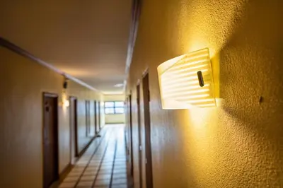 a lightswitch on a wall in a hallway at The BRC Ao-nang Hotel in Ao Nang Beach